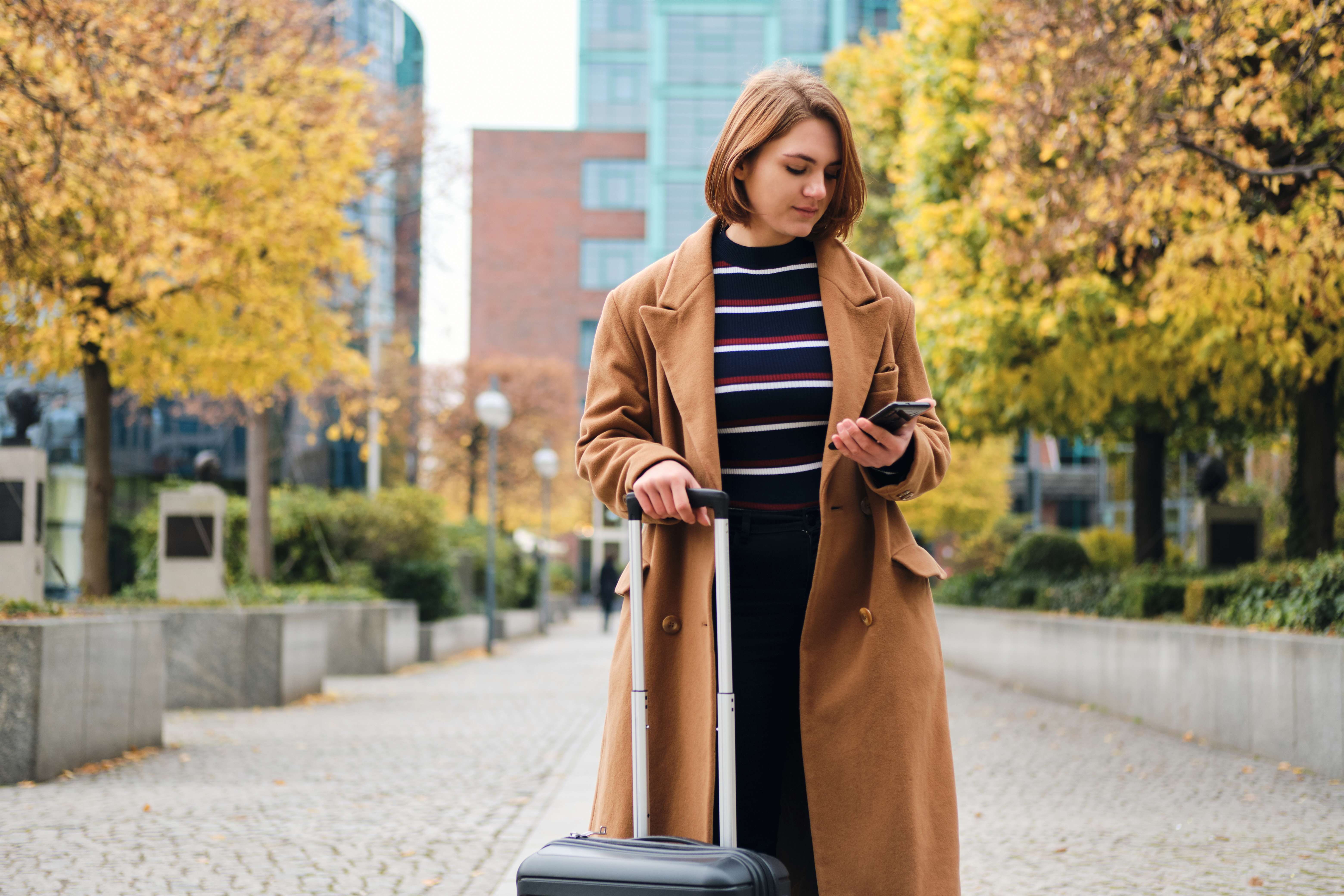 Woman Dragging Suitcase